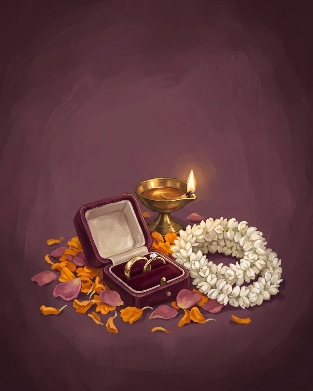 Two gold rings in an open velvet box on marigold and rose petals.
